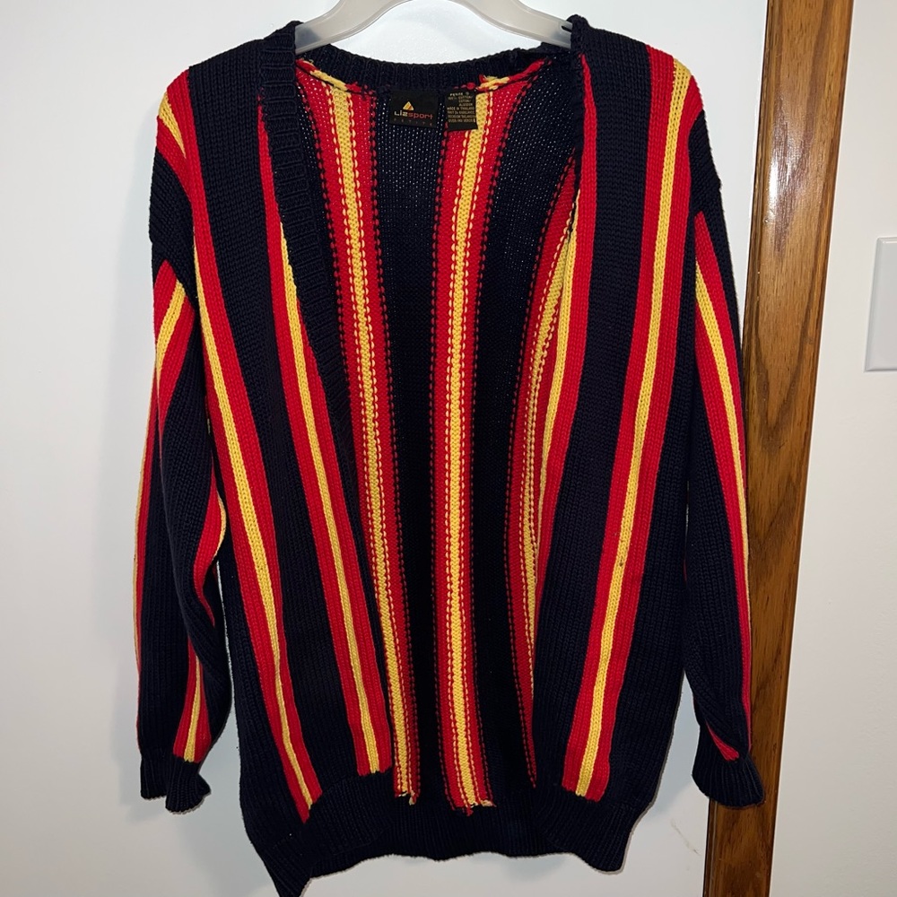 Cardigan size S petite but fits M-L as well, buttons up.